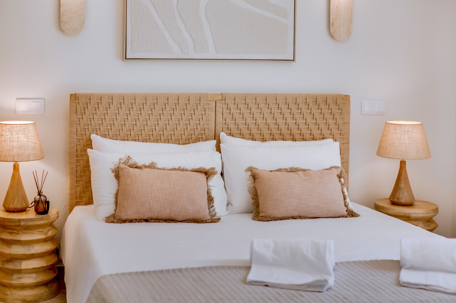 Bedroom with rattan furnishings and calm neutral tones