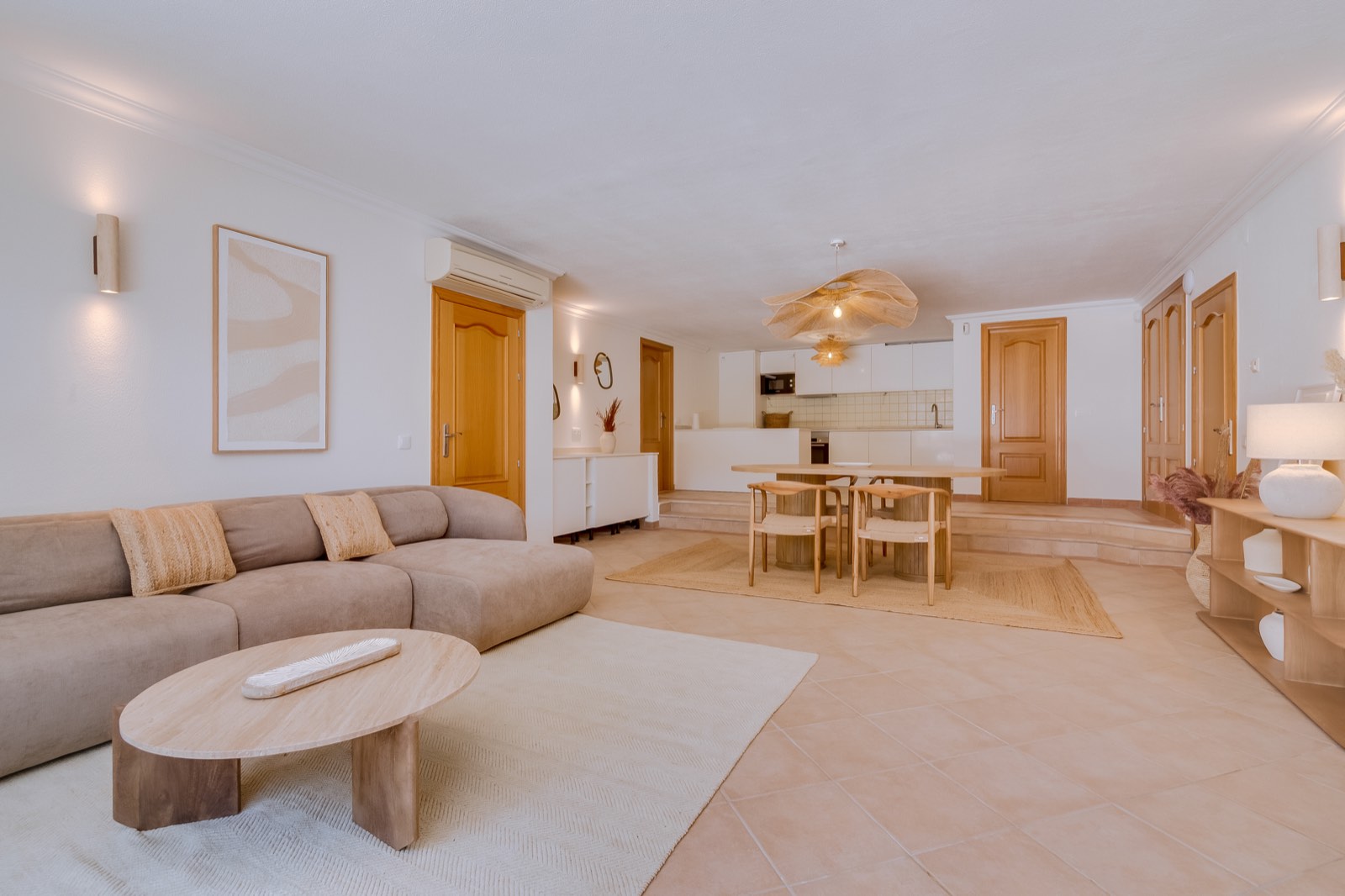 Open-plan lounge flowing into the dining space and kitchen