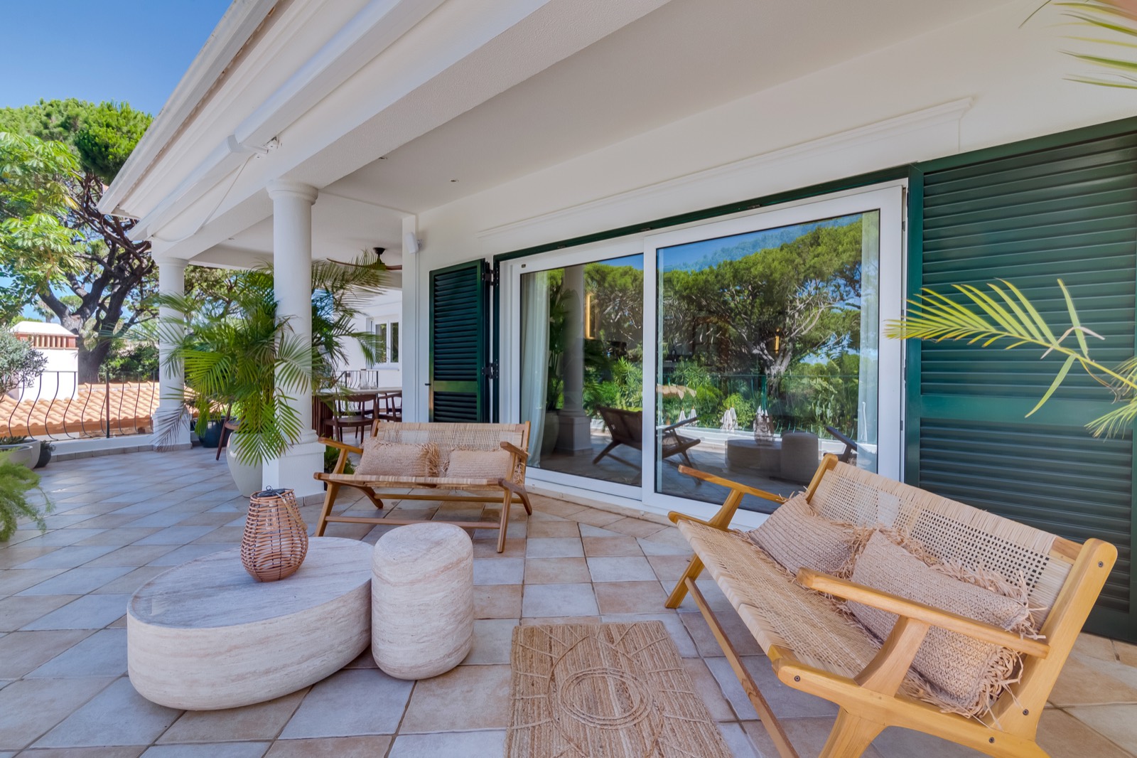 Shaded lounge seating on the villa terrace
